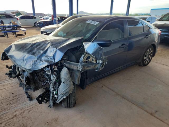 HONDA CIVIC EX 2017 with VIN 2HGFC2F74HH505825 - Photo from auction