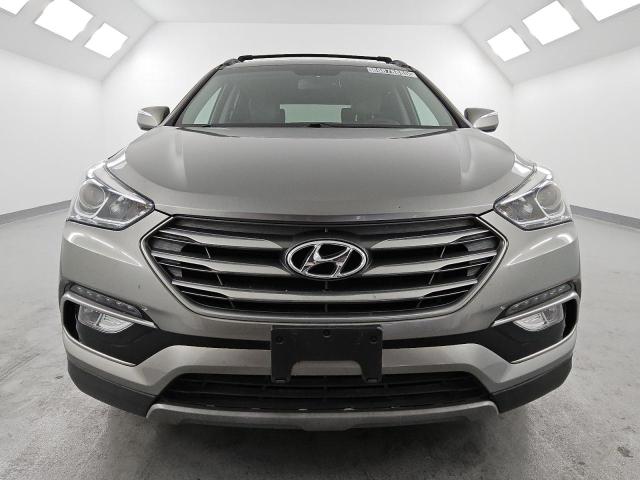 Photo 5 from auction – 2017 HYUNDAI SANTA FE S with VIN 5NMZU3LB2HH016304