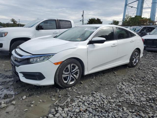 HONDA CIVIC LX 2018 with VIN 2HGFC2F57JH543036 - Photo from auction