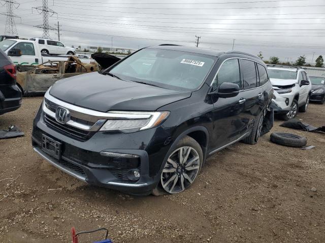 HONDA PILOT TOUR 2022 with VIN 5FNYF6H91NB016319 - Photo from auction