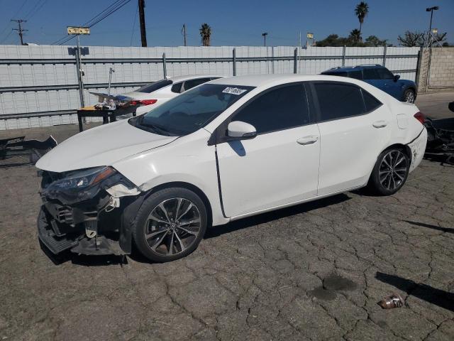 TOYOTA COROLLA L 2018 with VIN 5YFBURHE6JP825758 - Photo from auction