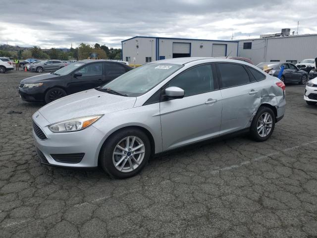 FORD FOCUS SE 2018 with VIN 1FADP3FE4JL304455 - Photo from auction