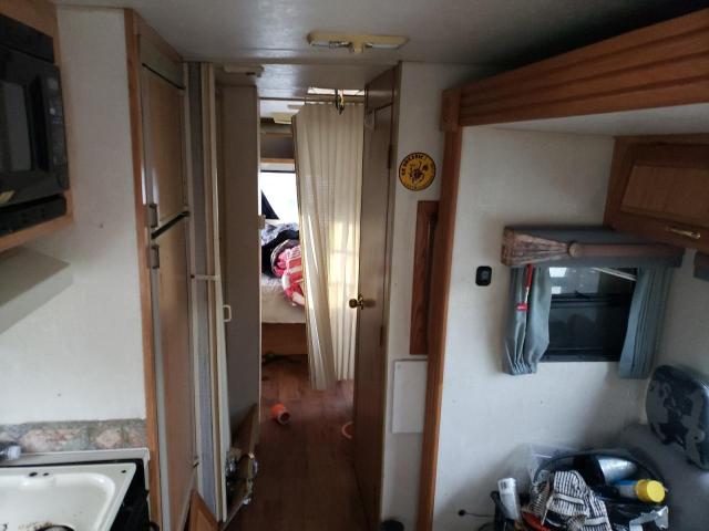 Фото 6 с аукциона – 1999 COACH 340QB с VIN 3FCMF53S7XJA11399