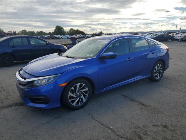 HONDA CIVIC EX 2018 with VIN 2HGFC2F74JH524011 - Photo from auction