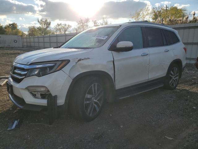 HONDA PILOT ELIT 2016 with VIN 5FNYF6H0XGB002004 - Photo from auction
