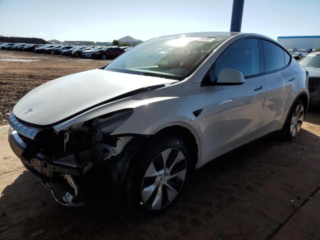 TESLA MODEL Y 2022 with VIN 7SAYGAEE3NF325682 - Photo from auction