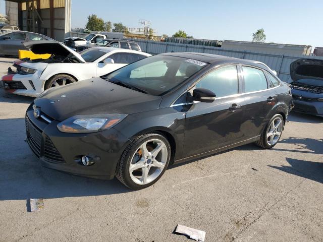 FORD FOCUS TITANIUM 2014 with VIN 1FADP3J2XEL161594 - Photo from auction