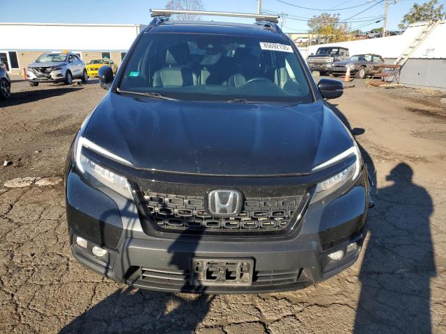Photo 5 from auction – 2020 HONDA PASSPORT T with VIN 5FNYF8H92LB014460