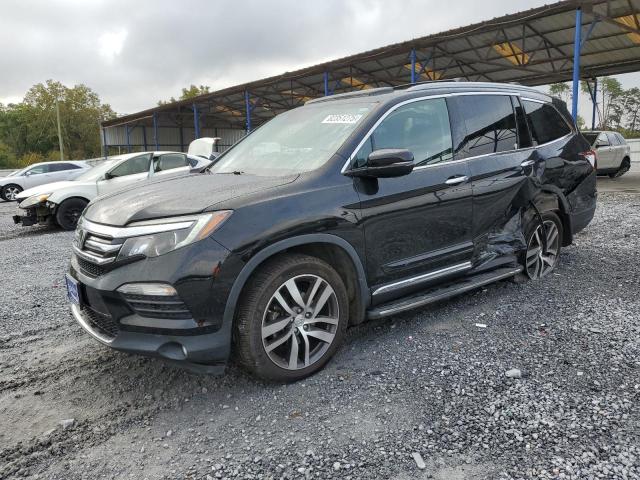 HONDA PILOT TOUR 2016 with VIN 5FNYF5H92GB046958 - Photo from auction