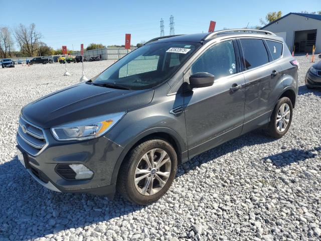 FORD ESCAPE SE 2018 with VIN 1FMCU9GD9JUC63009 - Photo from auction