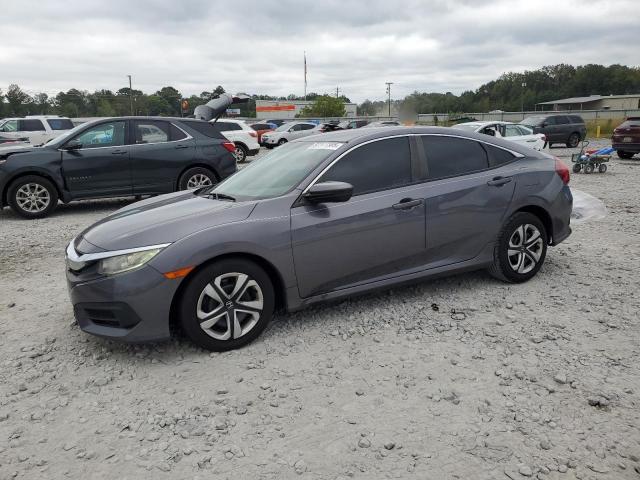 HONDA CIVIC LX 2018 with VIN 19XFC2F58JE036088 - Photo from auction
