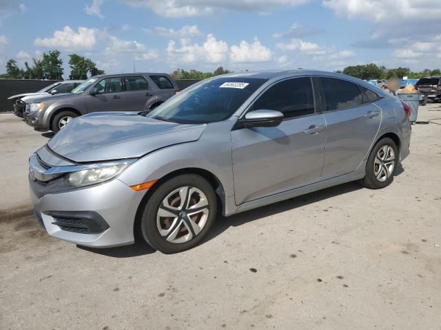 HONDA CIVIC LX 2018 with VIN 19XFC2F54JE022026 - Photo from auction