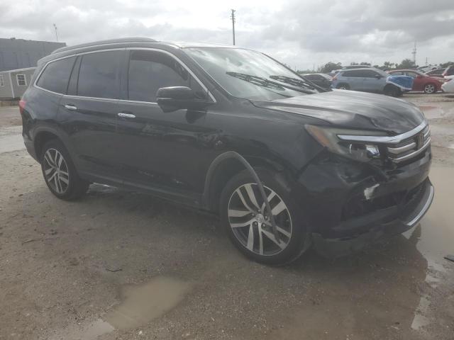 Photo 4 from auction – 2017 HONDA PILOT TOURING with VIN 5FNYF6H96HB092090