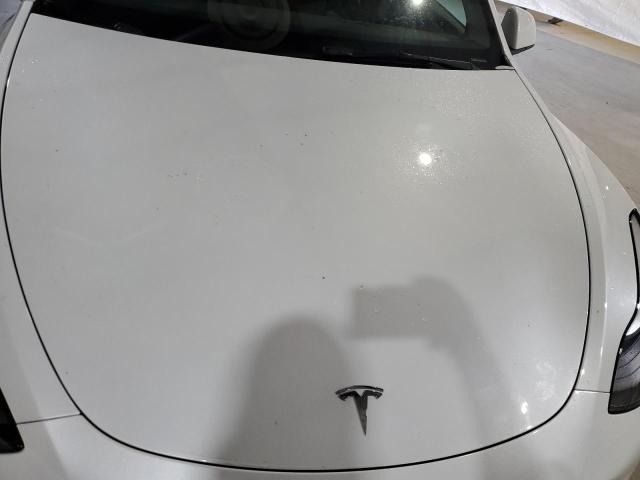 Photo 11 from auction – 2023 TESLA MODEL Y with VIN 7SAYGDEE9PA173165