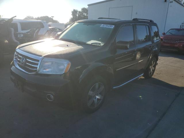 HONDA PILOT TOUR 2015 with VIN 5FNYF3H94FB011132 - Photo from auction