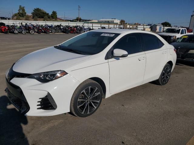 TOYOTA COROLLA L 2018 with VIN 5YFBURHE8JP807584 - Photo from auction