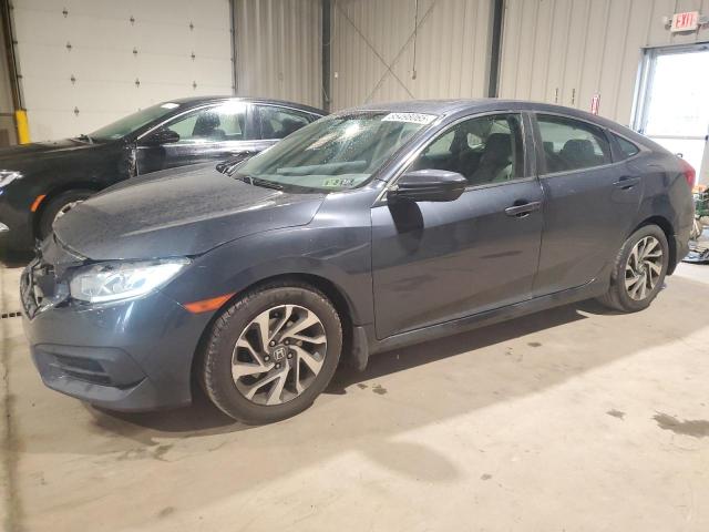 HONDA CIVIC EX 2018 with VIN 2HGFC2F70JH516598 - Photo from auction