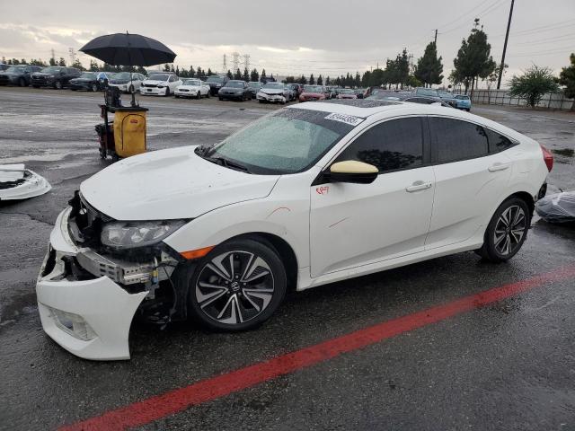 HONDA CIVIC EX 2018 with VIN JHMFC1F34JX040646 - Photo from auction