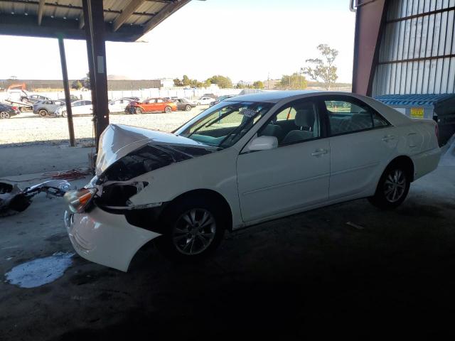 TOYOTA CAMRY LE 2004 with VIN 4T1BF30K04U077293 - Photo from auction