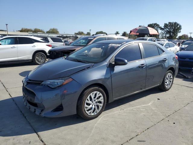 TOYOTA COROLLA L 2018 with VIN 5YFBURHE3JP855137 - Photo from auction