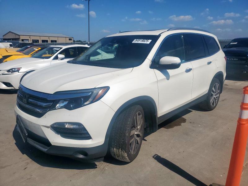 HONDA PILOT TOUR 2018 with VIN 5FNYF5H98JB003510 - Photo from auction