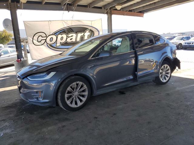 TESLA MODEL X 2018 with VIN 5YJXCBE22JF115407 - Photo from auction
