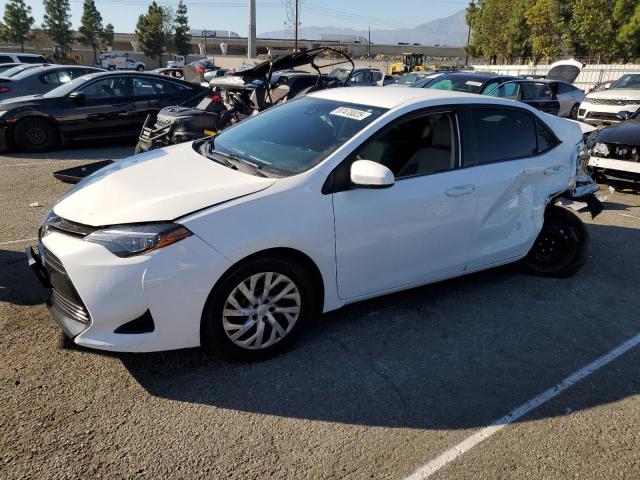 TOYOTA COROLLA L 2018 with VIN 5YFBURHE7JP853889 - Photo from auction