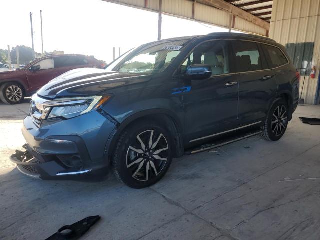 HONDA PILOT TOUR 2022 with VIN 5FNYF5H69NB024359 - Photo from auction