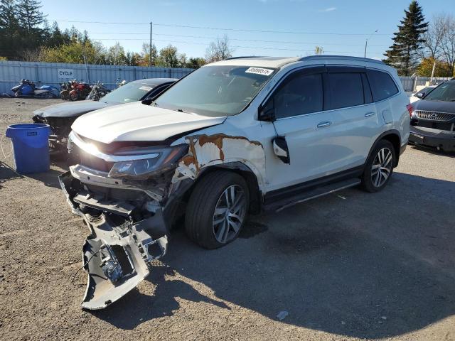 HONDA PILOT TOUR 2016 with VIN 5FNYF6H98GB501186 - Photo from auction