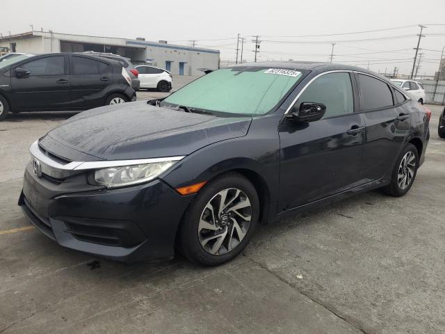HONDA CIVIC EX 2018 with VIN 2HGFC2F70JH525348 - Photo from auction