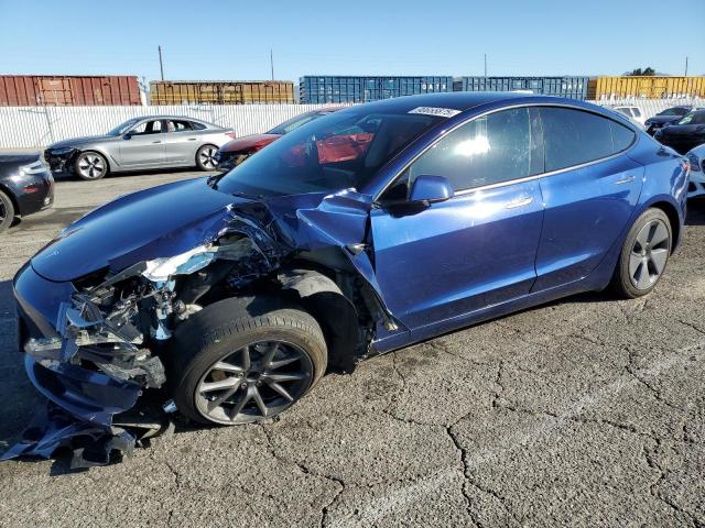 TESLA MODEL 3 2022 with VIN 5YJ3E1EAXNF358057 - Photo from auction