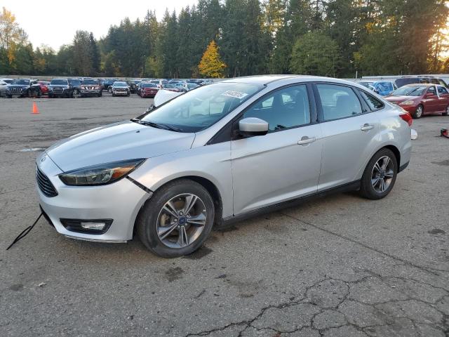 FORD FOCUS SE 2018 with VIN 1FADP3FE5JL211962 - Photo from auction