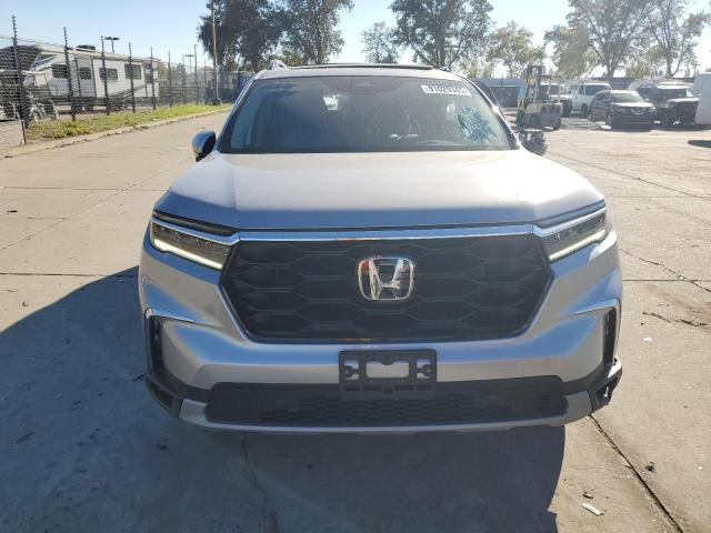 Photo 5 from auction – 2025 HONDA PILOT TOUR with VIN 5FNYG2H78SB017113