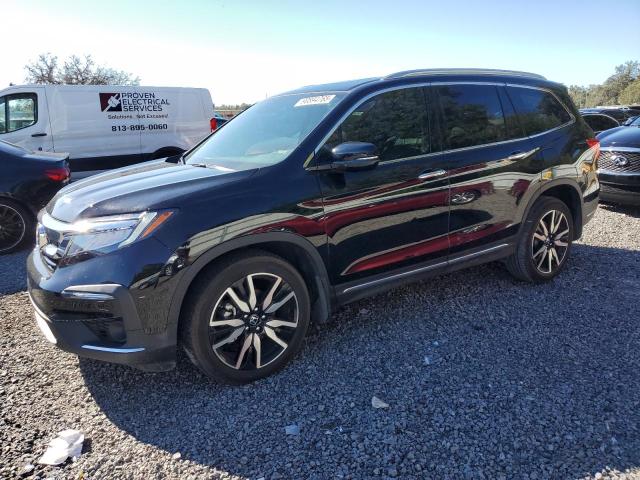 HONDA PILOT TOUR 2019 with VIN 5FNYF5H65KB010731 - Photo from auction