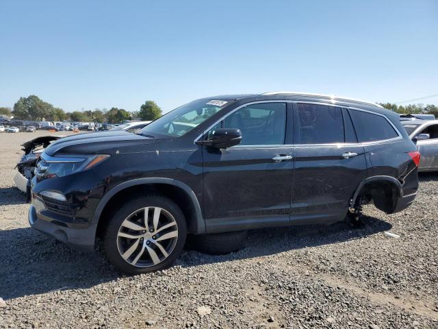 HONDA PILOT TOUR 2016 with VIN 5FNYF6H93GB035165 - Photo from auction
