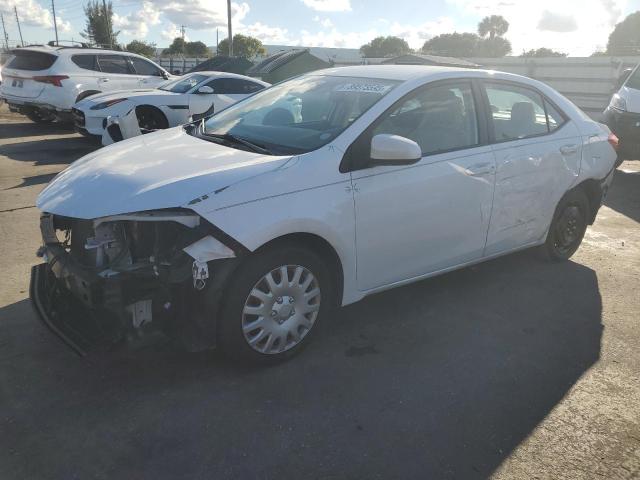 TOYOTA COROLLA L 2019 with VIN 5YFBURHE9KP859839 - Photo from auction