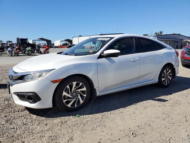 HONDA CIVIC EX 2018 with VIN 19XFC2F8XJE207790 - Photo from auction