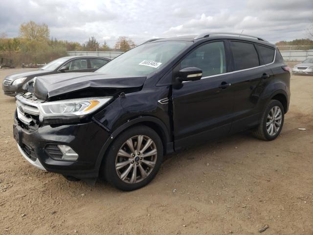 FORD ESCAPE TITANIUM 2017 with VIN 1FMCU0J90HUB91143 - Photo from auction