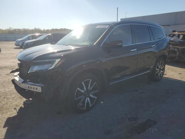 HONDA PILOT TOUR 2021 with VIN 5FNYF6H96MB009946 - Photo from auction