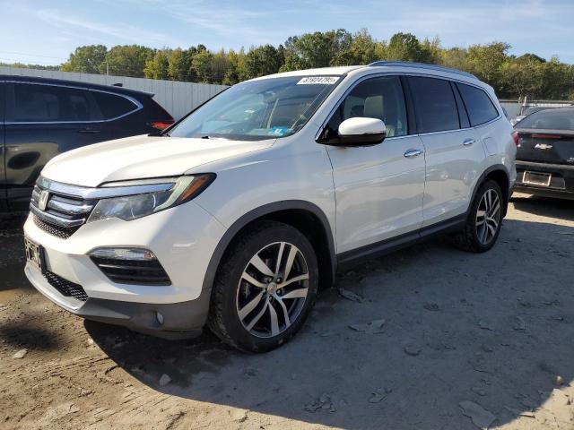 HONDA PILOT TOUR 2017 with VIN 5FNYF6H90HB105142 - Photo from auction