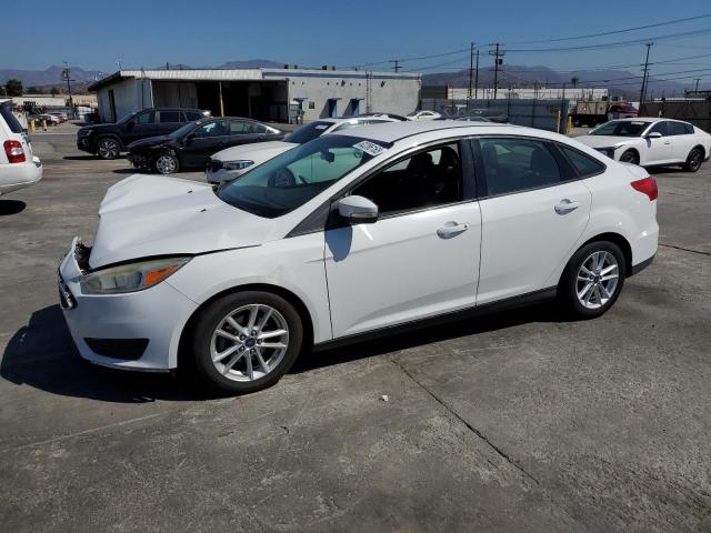 FORD FOCUS SE 2015 with VIN 1FADP3F20FL379733 - Photo from auction