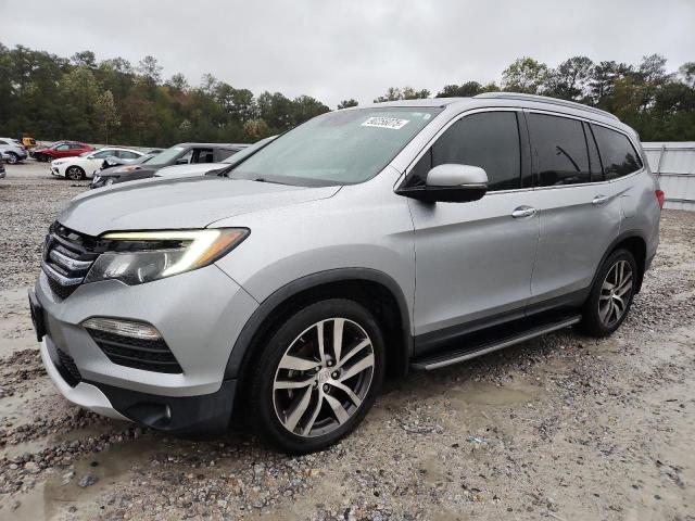 HONDA PILOT TOUR 2017 with VIN 5FNYF5H9XHB004197 - Photo from auction