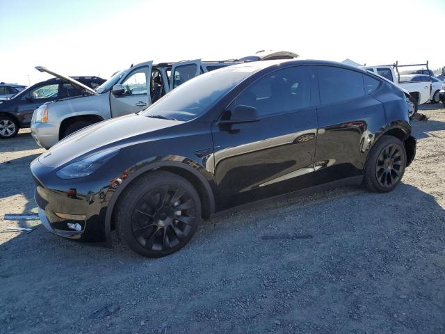 TESLA MODEL Y 2023 with VIN 7SAYGDEE3PF907060 - Photo from auction