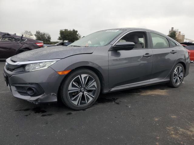 HONDA CIVIC EX 2018 with VIN JHMFC1F37JX040866 - Photo from auction