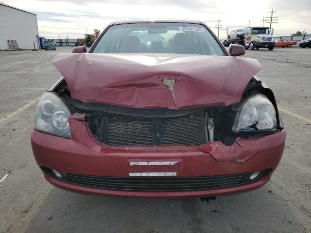 Photo 5 from auction – 2006 KIA OPTIMA LX with VIN KNAGE123665056854
