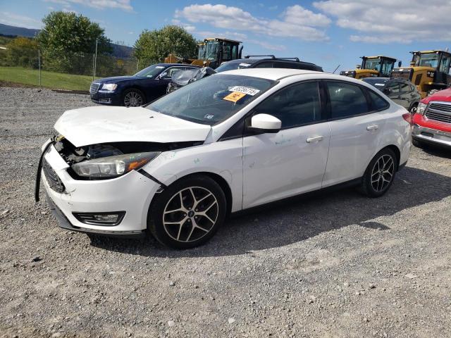 FORD FOCUS SE 2018 with VIN 1FADP3F21JL319761 - Photo from auction