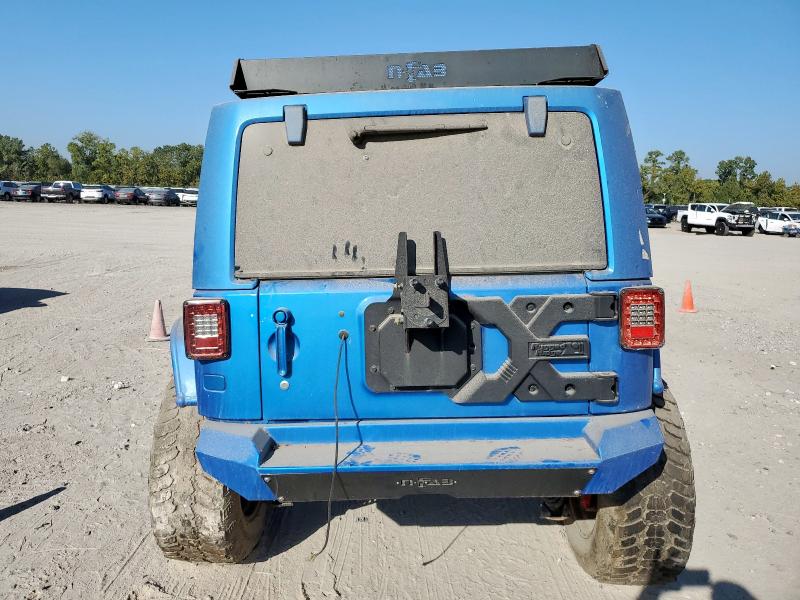 Photo 6 from auction – 2016 JEEP WRANGLER U with VIN 1C4BJWFG2GL250572