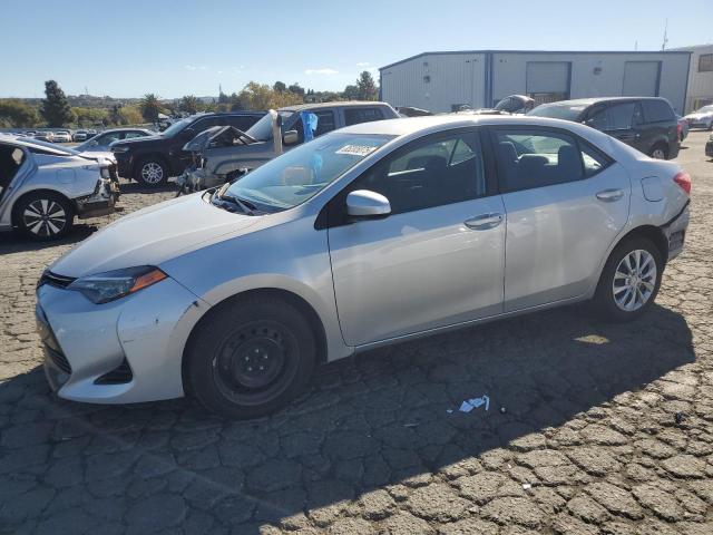 TOYOTA COROLLA L 2019 with VIN 5YFBURHE8KP874946 - Photo from auction