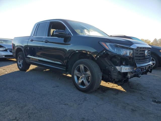 Photo 4 from auction – 2023 HONDA RIDGELINE with VIN 5FPYK3F56PB001223