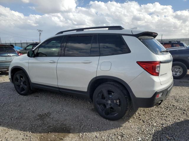 Photo 2 from auction – 2021 HONDA PASSPORT ELITE with VIN 5FNYF8H02MB039538
